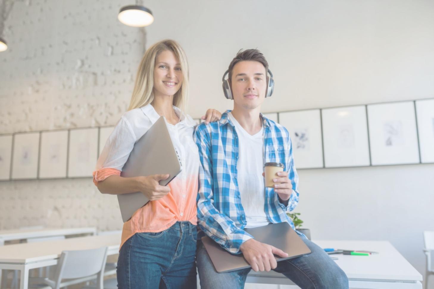 Student working on financial planning with calculator and documents spread on desk